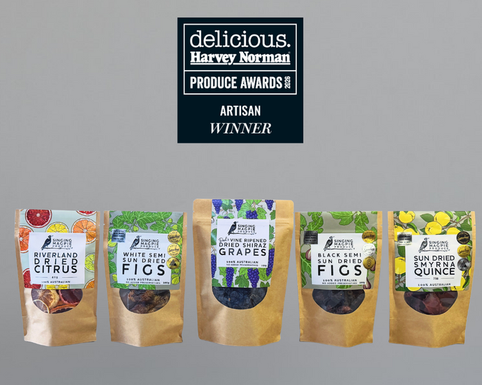 ive stand-up pouches of dried fruit from Singing Magpie Produce are displayed against a solid gray background, with a black award badge at the top reading 'delicious. Harvey Norman PRODUCE AWARDS ARTISAN WINNER' 2026